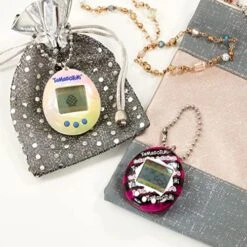 Tamagotchi 42885NBNP Original Flames -Feed, Care, Nurture-Virtual Pet With Chain For On The Go Play -Folkmanis Toys Shop 51BkyuWlqaL